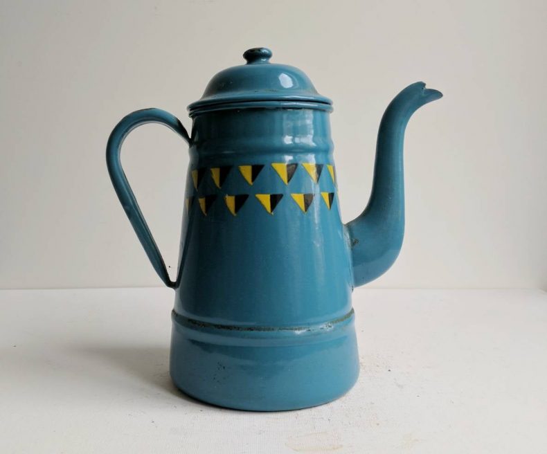 blue enamelware coffee pot with graphic triangles