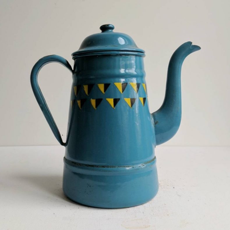 blue enamelware coffee pot with graphic triangles