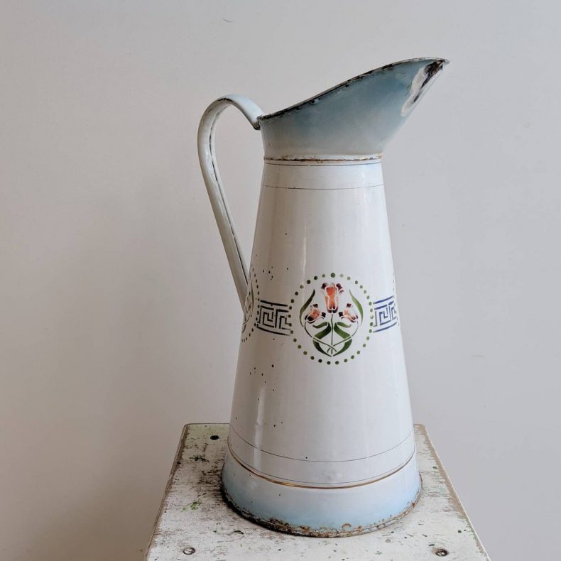 large blue and white enamelware water jug