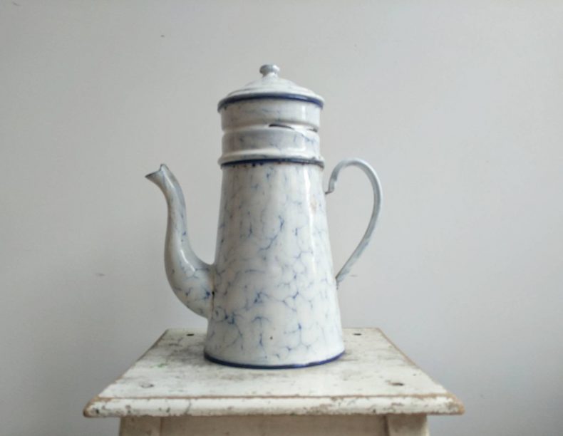 large white and blue enamelware pitcher