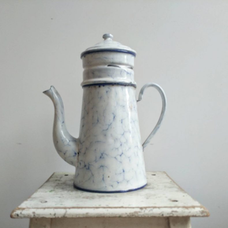 large white and blue enamelware pitcher