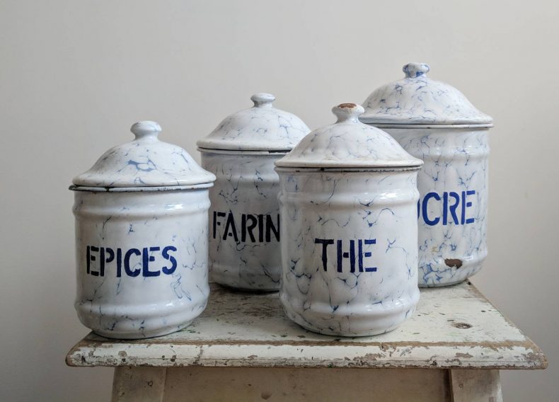 set of four spice canisters in blue and white