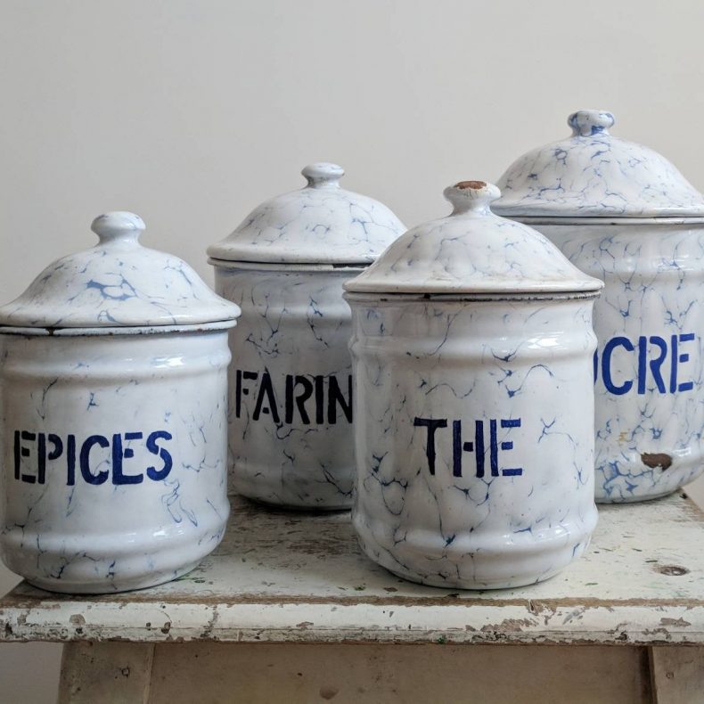 set of four spice canisters in blue and white